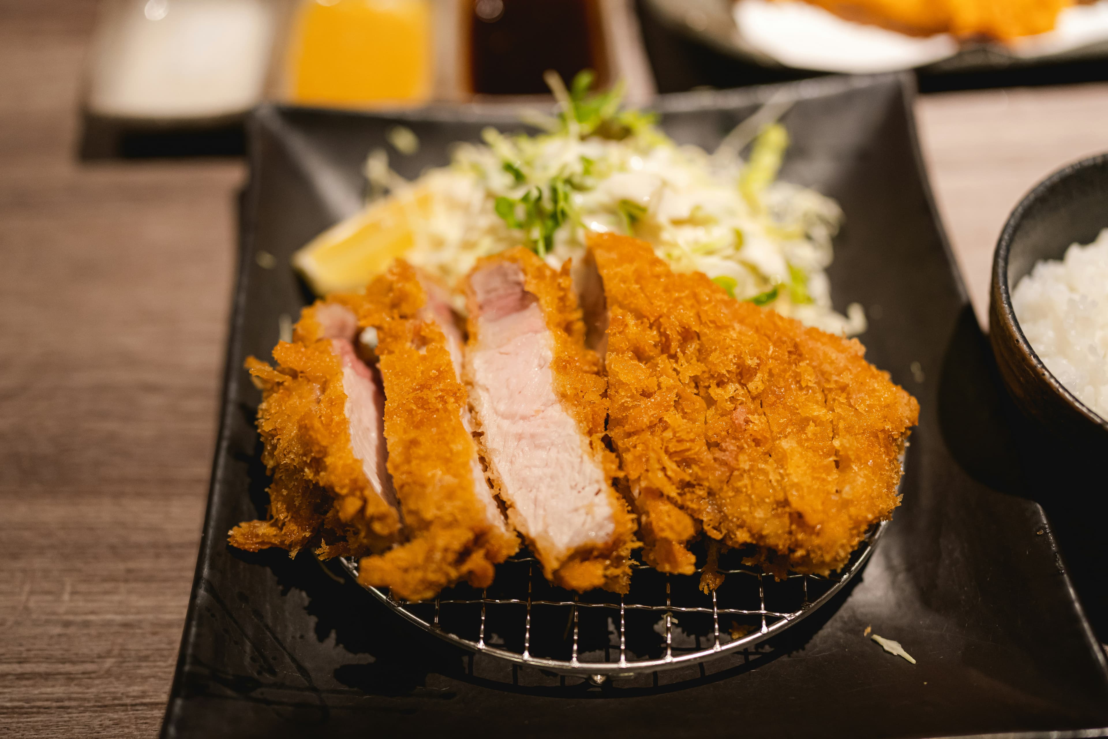 Tonkatsu set lunch with shredded cabbage and rice served at the clubhouse restaurant